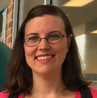 Woman with brown hair and glasses